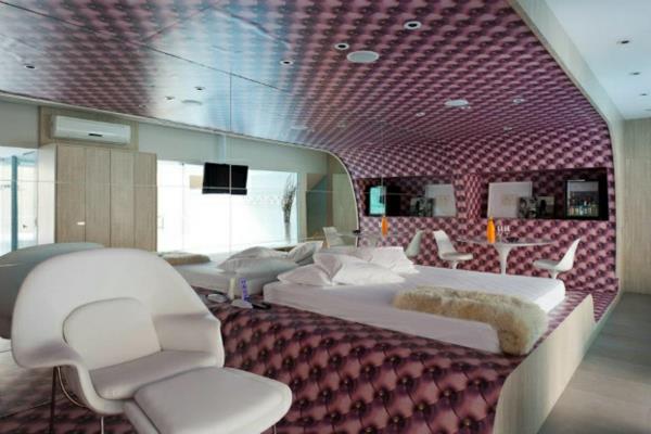 futuristinen makuuhuone, joka on orgaanisesti kaareva laventeliin