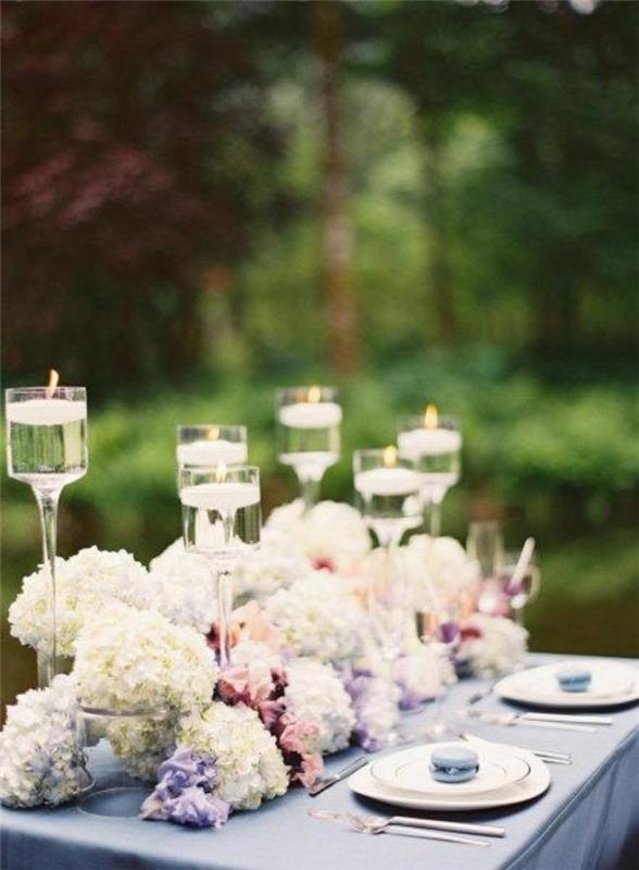 puutarhajuhla koristelu pöytä koristelu juhla kukat kynttilät