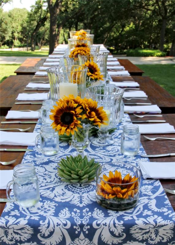 puutarhajuhlapöydän koristeet tuulivalot auringonkukat mehikasveja