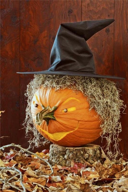 Halloween -kurpitsan veistäminen ja pelottavien olentojen koristelu