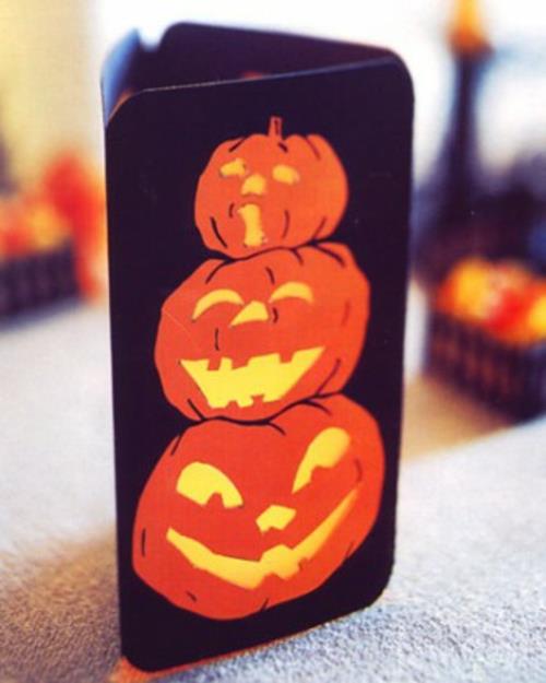 halloween -pöytäkoriste lyhdyt maalattuilla kurpitsan lyhtyillä
