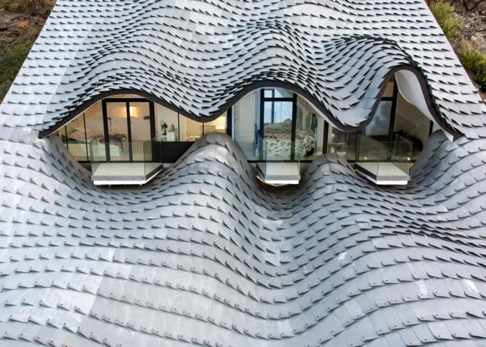 talo meren rannalla ostaa espanja leija suunnittelu moderni arkkitehtuuri aaltoileva katto
