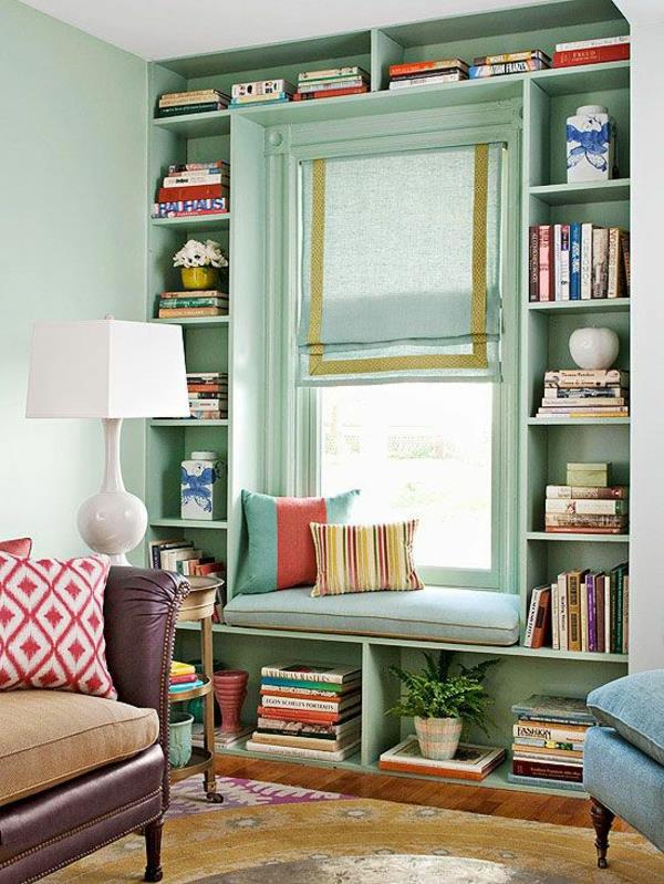 kotikirjasto kirjat hyllyt seinäsuunnittelu kauniit seinän värit olohuone