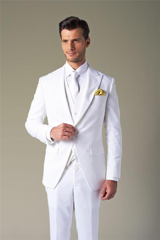 hääpuku miehet kokonaan valkoisissa tyylikkäissä pukuissa sulhanen