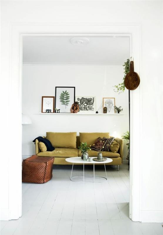 sisustussuunnittelu eläviä ideoita olohuone vihreä sohva seinähylly valkoinen lattia