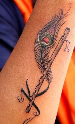 K Letter Tattoo med en fløjte