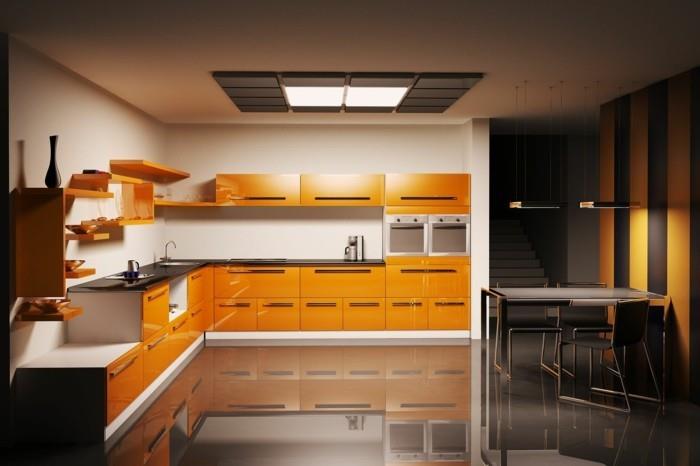 keittiön l-muotoiset oranssit keittiökaapit ja tummat lattiat