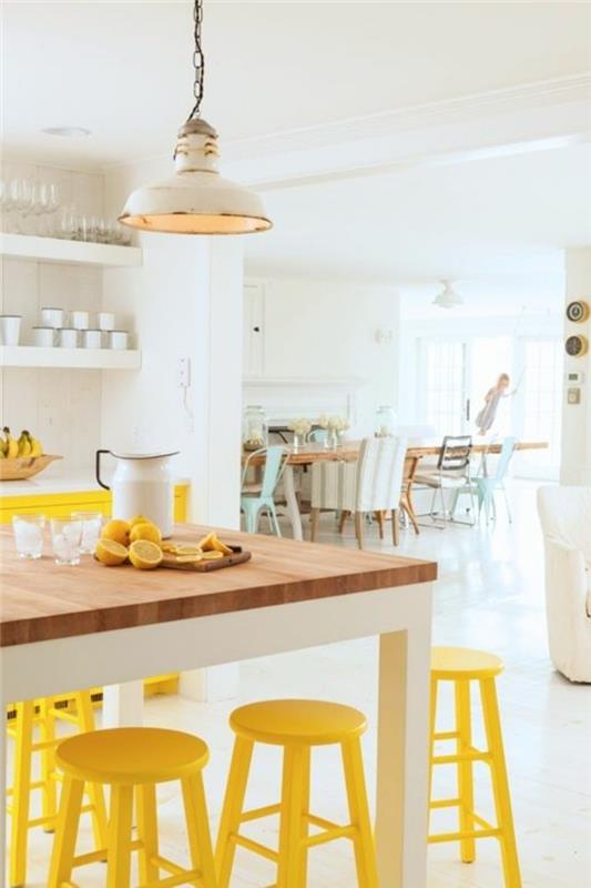 keittiön suunnittelu keltainen baarituoli keittiön pöytä valkoinen tunnelma