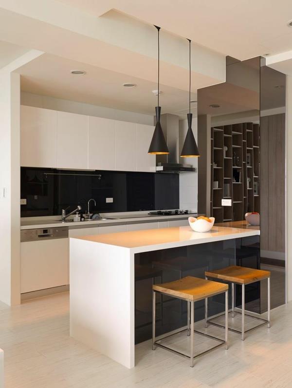 keittiön suunnittelu minimalistinen keittiösaari riippuvalaisimet musta