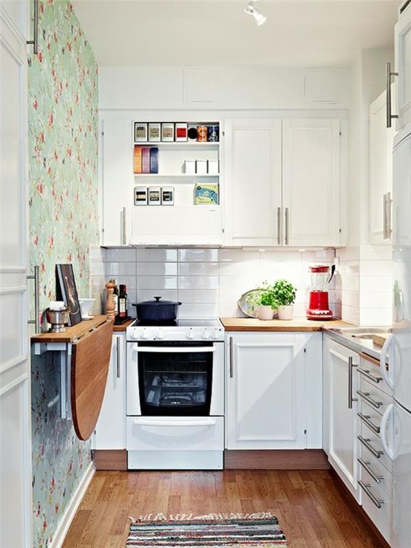 keittiöideat seinäpöytä taitettava mattojuoksija seinätaustakuva kukkakuvio valkoiset keittiökaapit