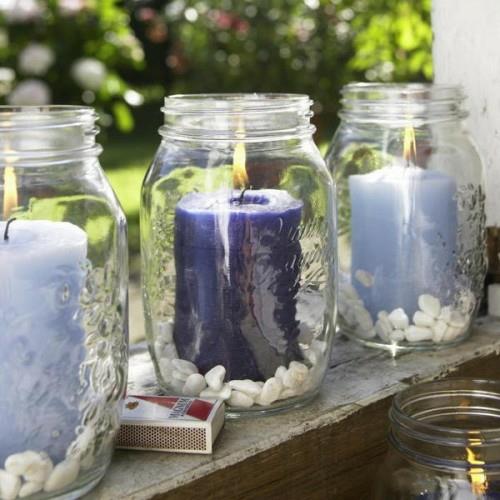 kynttilät sisustusideoita puutarha ulkopuolella tyylikäs lasit kiviä
