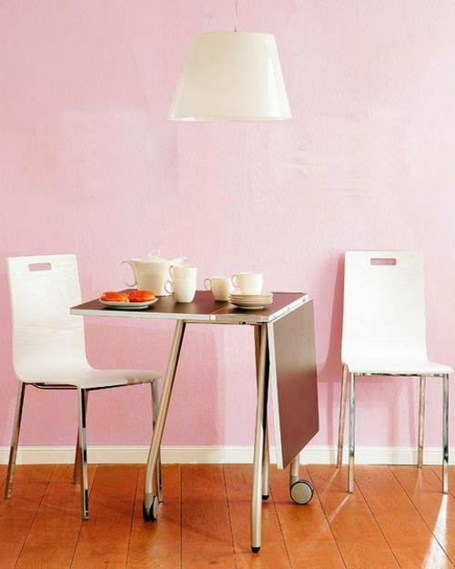 Kokoontaitettava pöytä keittiössä metallimateriaali idea vaaleanpunainen seinä