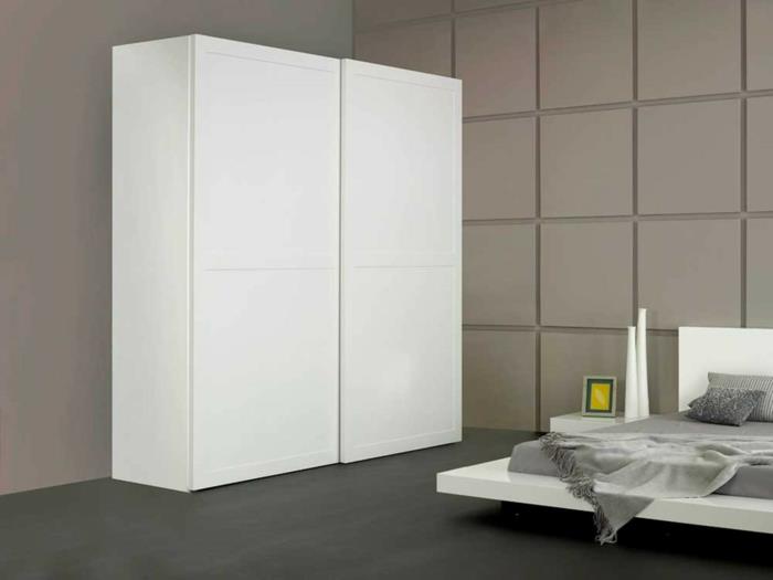 vaatekaappi valkoinen tyylikäs makuuhuone, jossa on minimalistinen sänky