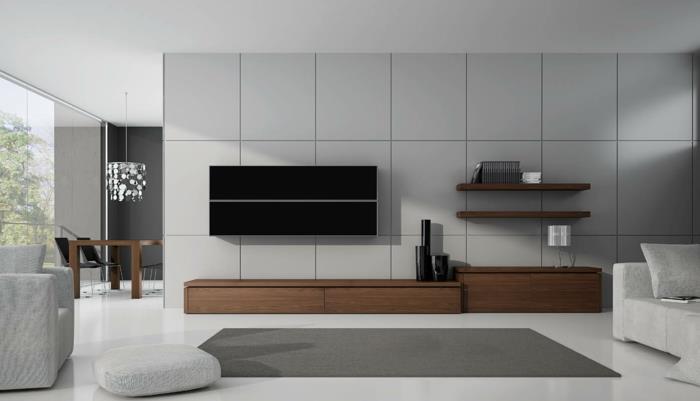 Pieni olohuone, jossa on minimalistinen sisustus kodin huonekalujen istuintyynyt