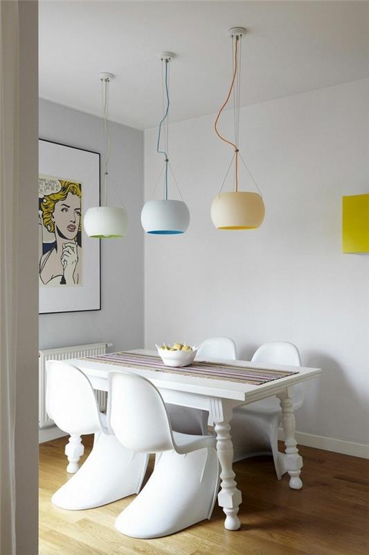 lamput ruokasali pastelliväreissä ja valkoinen ruokapöytä