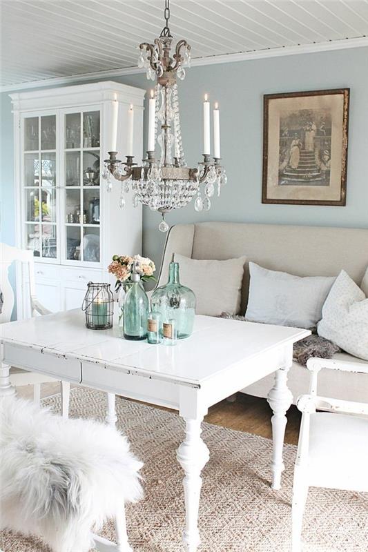 huonekalut nuhjuinen tyylikäs olohuone sisalimatto valkoinen sisustus vaaleansiniset seinät