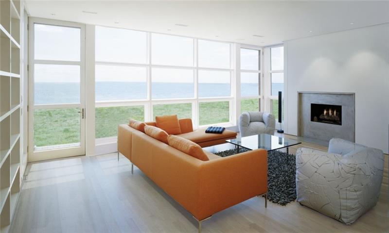minimalistinen merinäköala oranssi nahkasohva lasipöytä