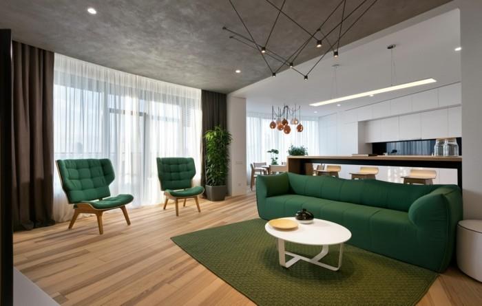 elävä minimalistinen vihreä sohva vihreä matto avoin suunnitelma