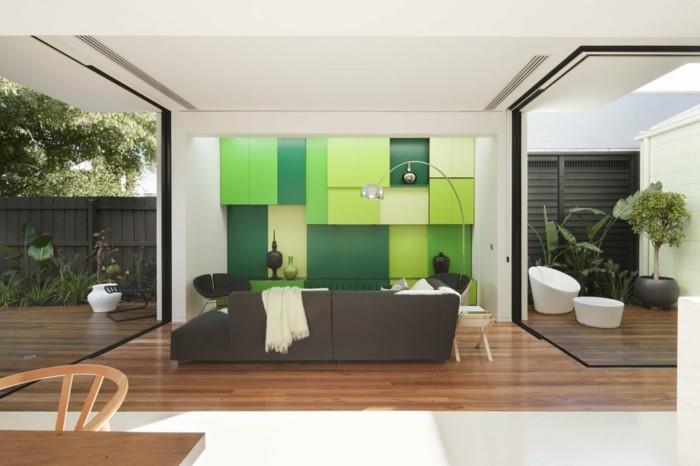 minimalistinen olohuone moderni olohuone vihreä seinäyksikkö raikas ja tilava