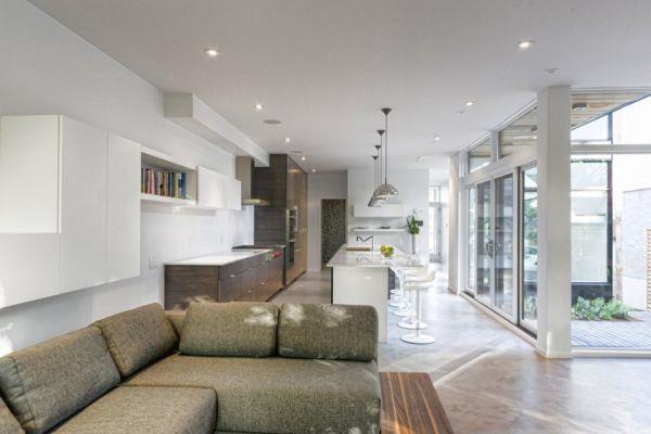 minimalistinen asuinpaikka upeat luonnolliset vivahteet saumaton siirtyminen keittiön ja olohuoneen välillä