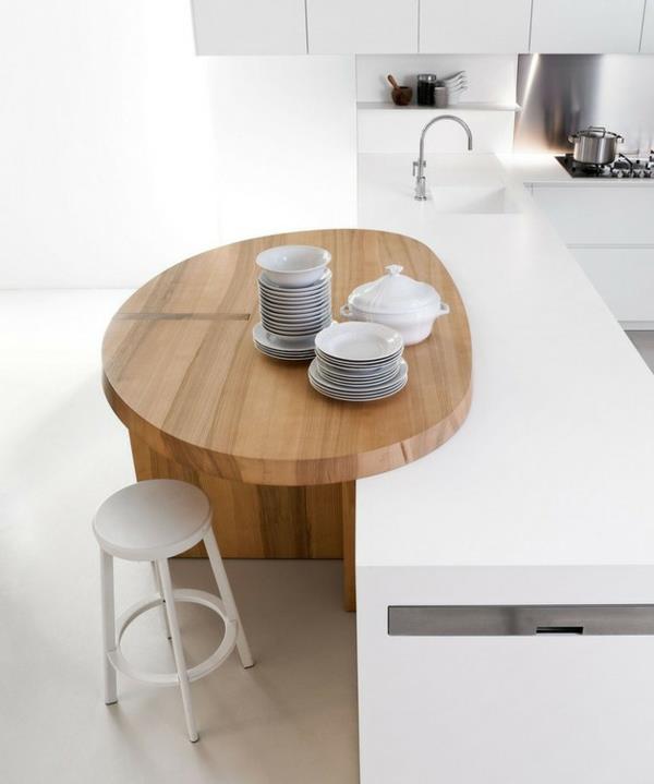 minimalistinen valkoinen keittiö ruokailutila puu elmar studio astiat