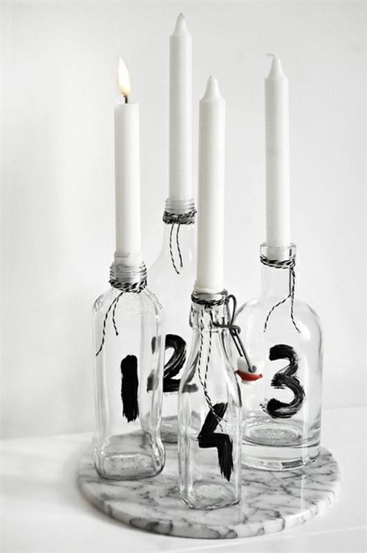 minimalistinen adventtiseppele koristetaan lasipulloilla