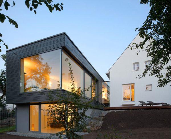 moderni talo laajennus geometriset muodot valaistus ikkunat