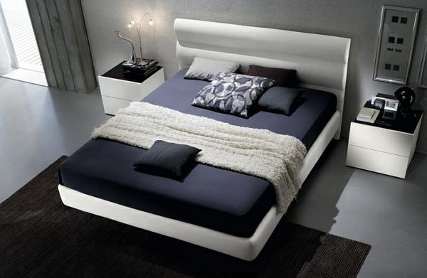 moderni-makuuhuone-värit-musta-valkoinen-sänky-matto-yöpöydät