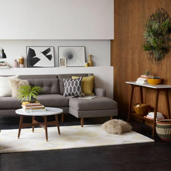 moderni seinäsuunnittelu olohuoneen sohva sohvapöytä pyöreitä huonekasveja