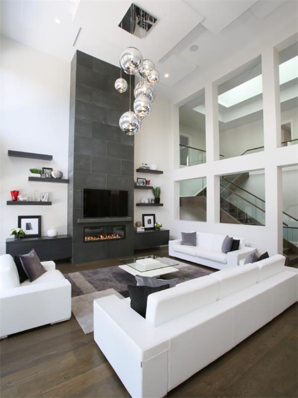 moderni olohuone valkoinen huonekalut harmaa aksentti seinä fancy riippuvalaisimet lasi pöytä harmaa matto
