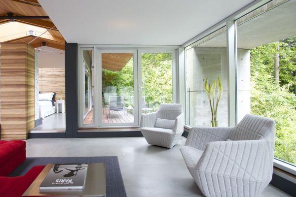 moderni talo vihreässä tikatussa design -nojatuolissa