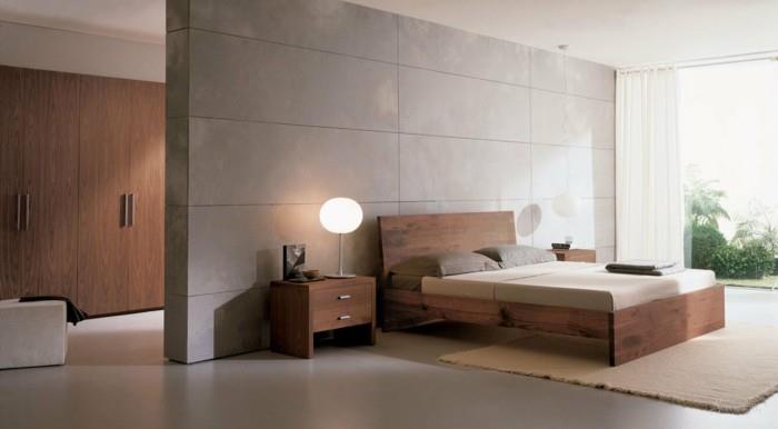 modernissa minimalistisessa makuuhuoneessa on maanläheiset värit