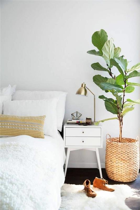 moderni elävä minimalistinen makuuhuone, jossa on kodikas ilme