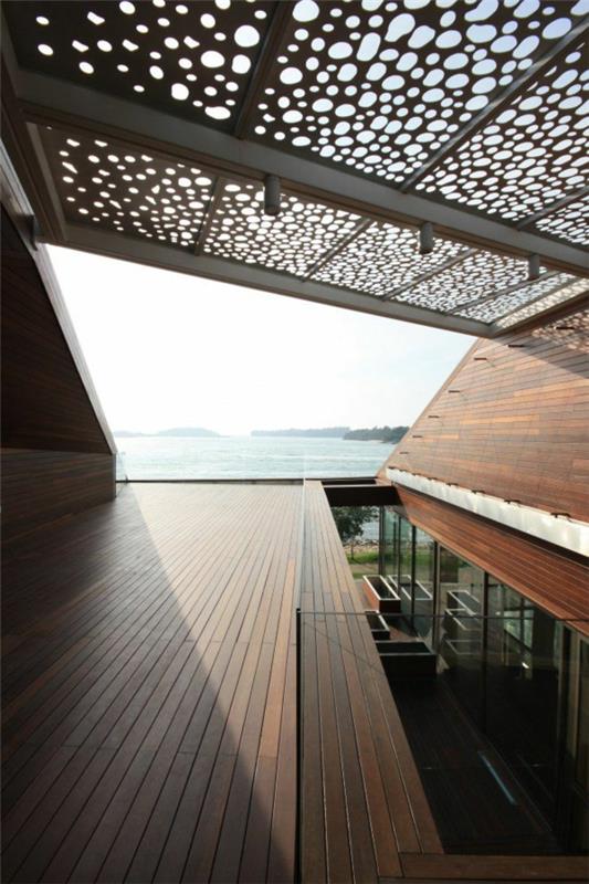 pergola metallibetoni moderni arkkitehtuuri terassi merinäköalalla lomamökki