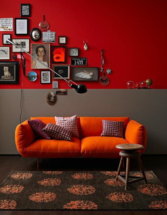 sisustussuunnittelu väreillä oranssi punainen sohvatyynyt deco -seinä