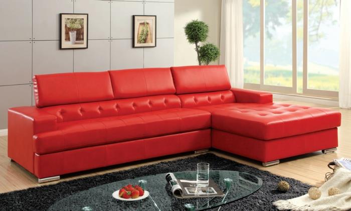 punaiset sohvat olohuone harmaa matto lasi soikea sohvapöytä