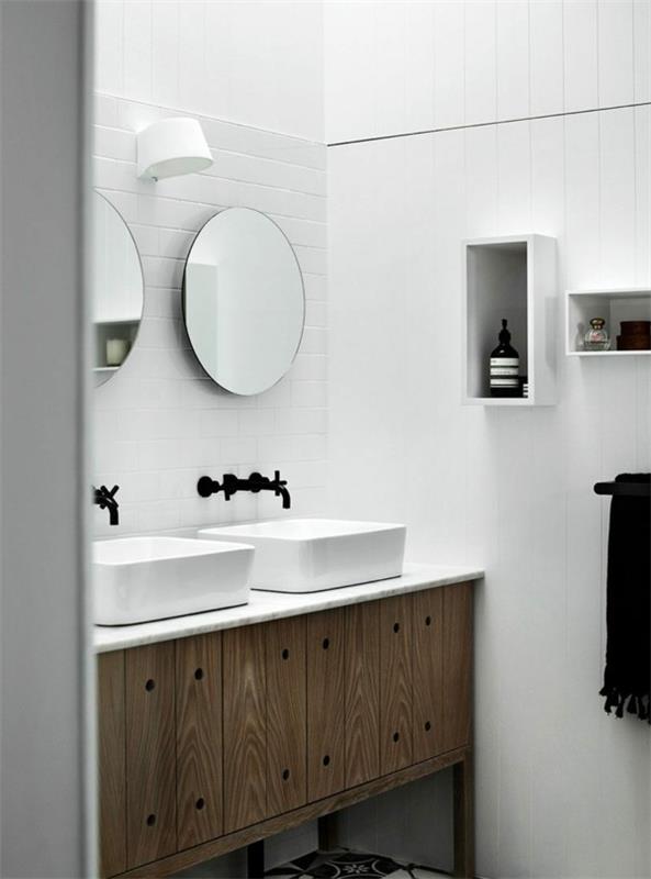 pyöreä kylpyhuoneen peili tyylikäs alaosa valkoiset seinät