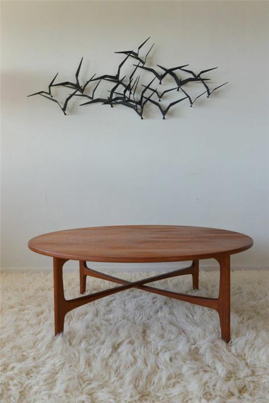 pyöreä sohvapöytä puu olohuoneen sisustusideoita pehmeä matto seinäkoriste