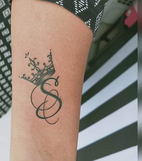 Sleek S Tattoo Design On The Arm00