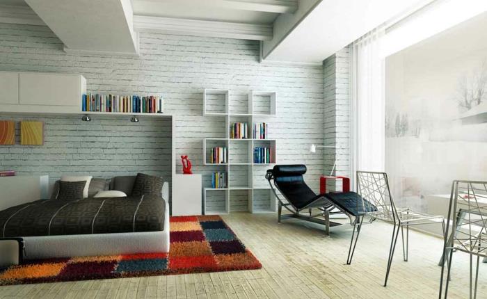 makuuhuoneen sisustusesimerkit värillinen matto kiviseinä rentouttava nojatuolin hylly