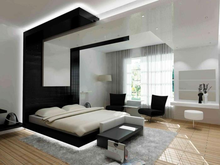 makuuhuoneen sisustusesimerkkejä musta aksenttiseinä sängyn takana harmaa matto
