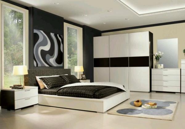 makuuhuoneen sisustus valkoiset kaapit abstrakti seinätaide matto yökonsoli