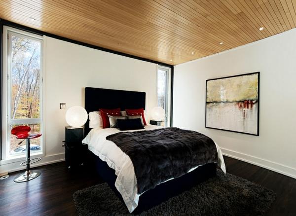 makuuhuoneen värit ideoita mustavalkoinen punainen sängyn kuva kehyksessä
