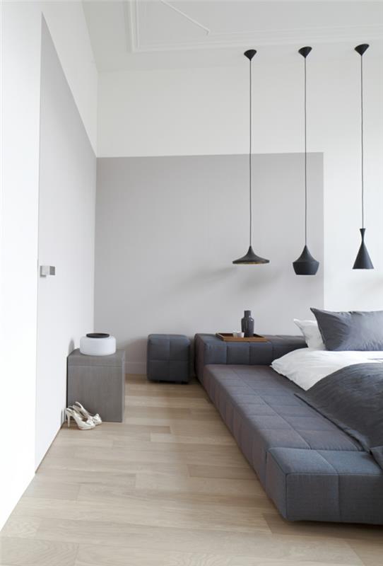 makuuhuoneen harmaa vaaleanharmaat seinät moderni sänky