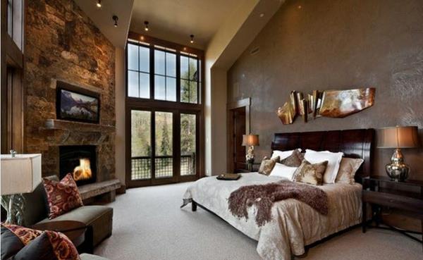 makuuhuoneen ideat perinteiseen tyyliin kiviseinä takka seinämaali ruskeat puukalusteet