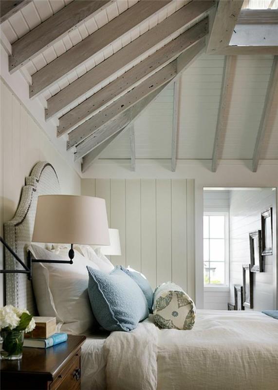 makuuhuone maalaistyylinen kalteva katto kirkas tunnelma tyylikäs sängynpääty