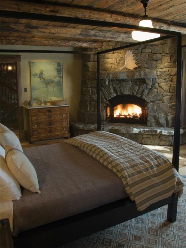 makuuhuone maalaistyylinen kiviseinä takka kodikas matto