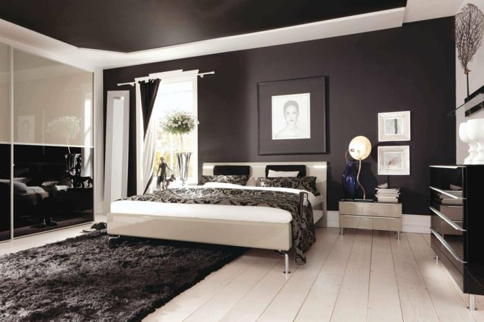 makuuhuone musta vaalea lattia moderni vaatekaappi liukuovet