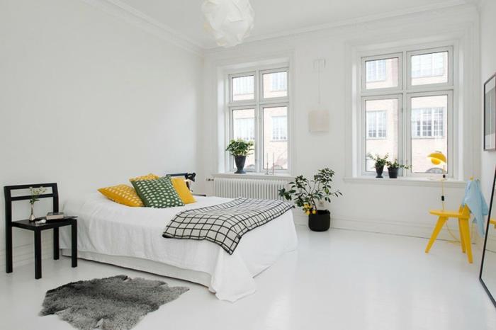 makuuhuone valkoinen keltainen aksentti turkis matto kasvit