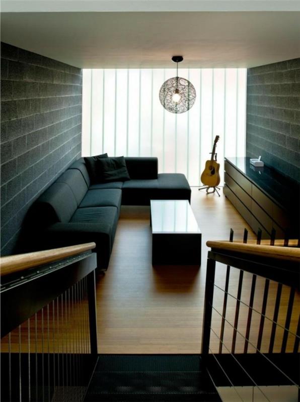 kaunis olohuone tumma sohva minimalistinen sisustus